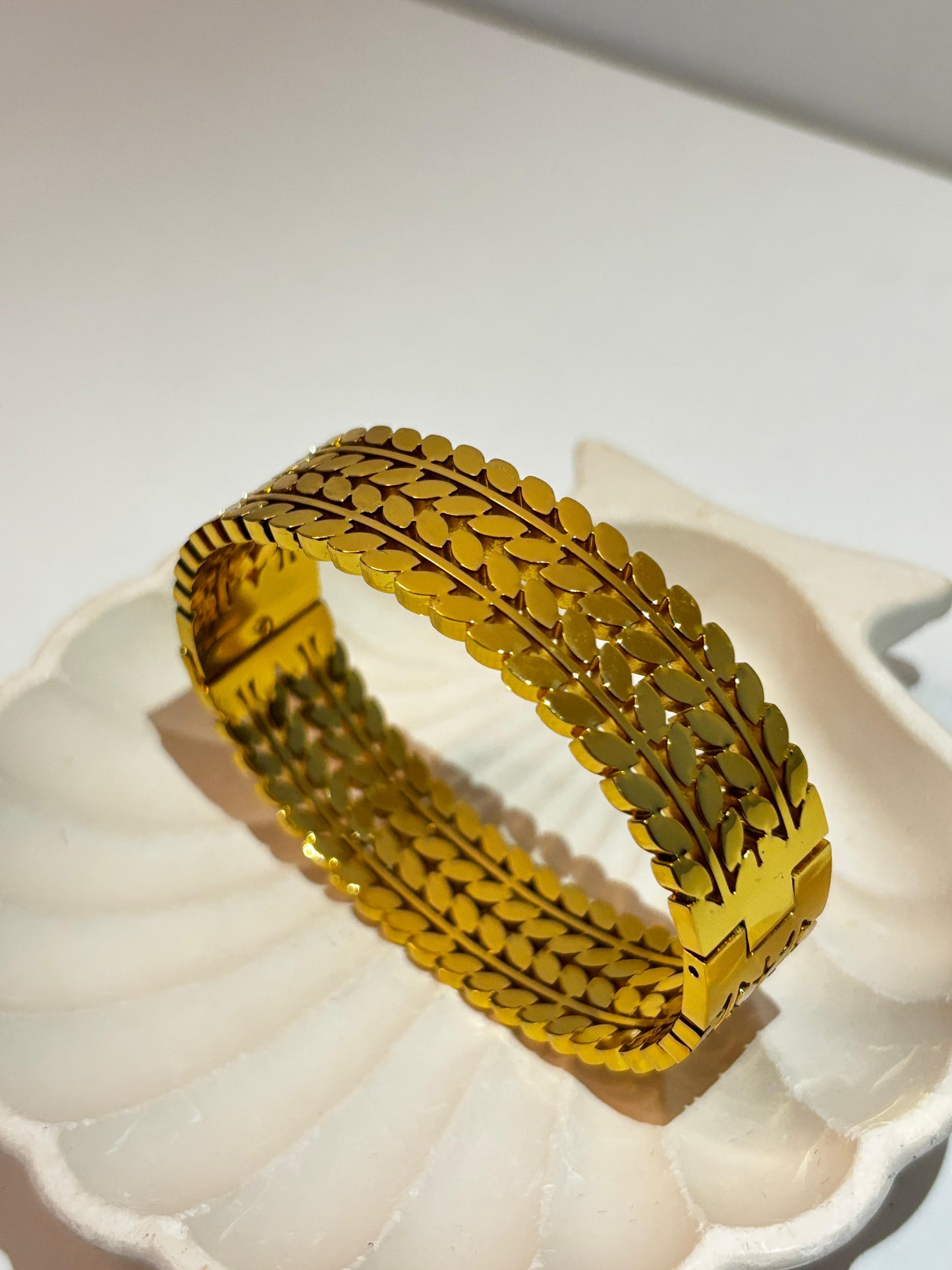 prominent triple-row leaf bangle