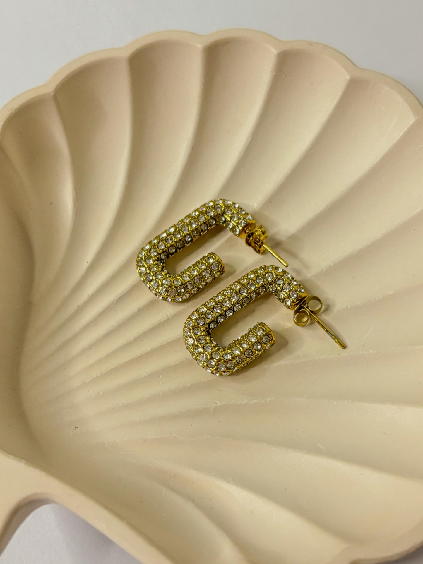 Dropped zircon stone curve hoops