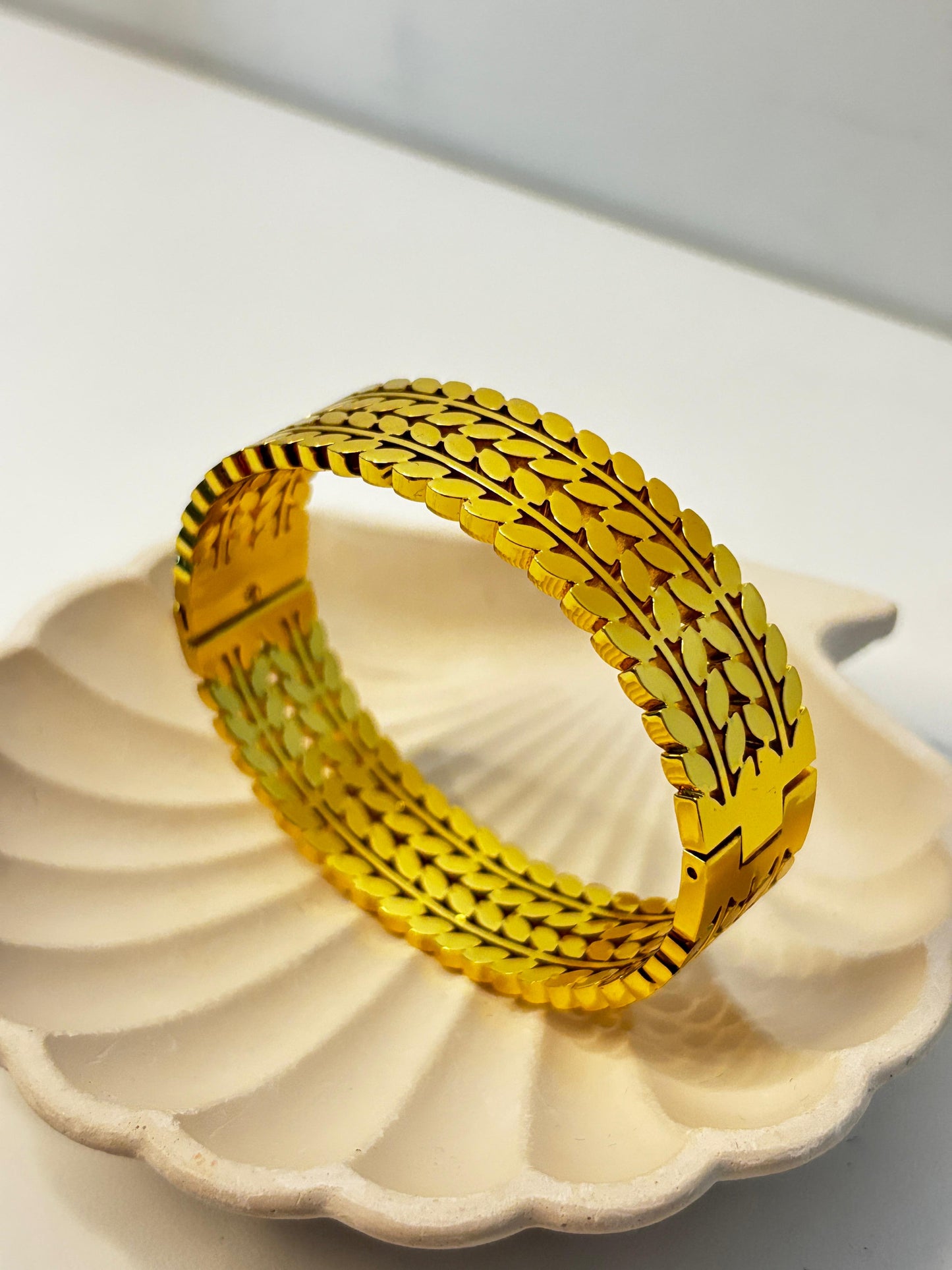 prominent triple-row leaf bangle